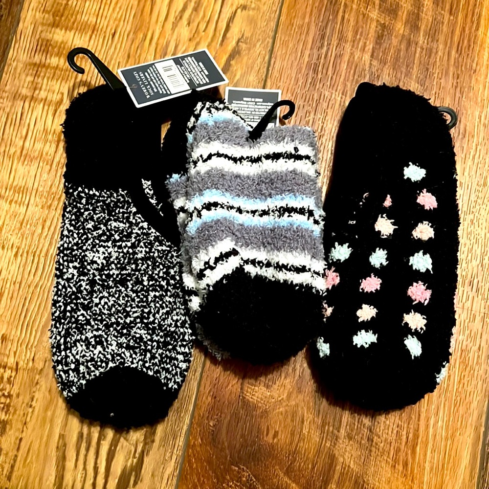3 pair of warm fuzzy socks. New with tags on. Fits shoe size 4-10